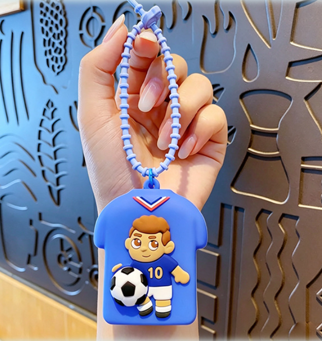 💥 BUY 2 GET 2 FREE + 💞50K+ SOLD!💥⚽Cute Football Player Squishy Keychain, Silicone Stress Relief Toy, Soccer Jersey Bag Charm for Kids & Adults
